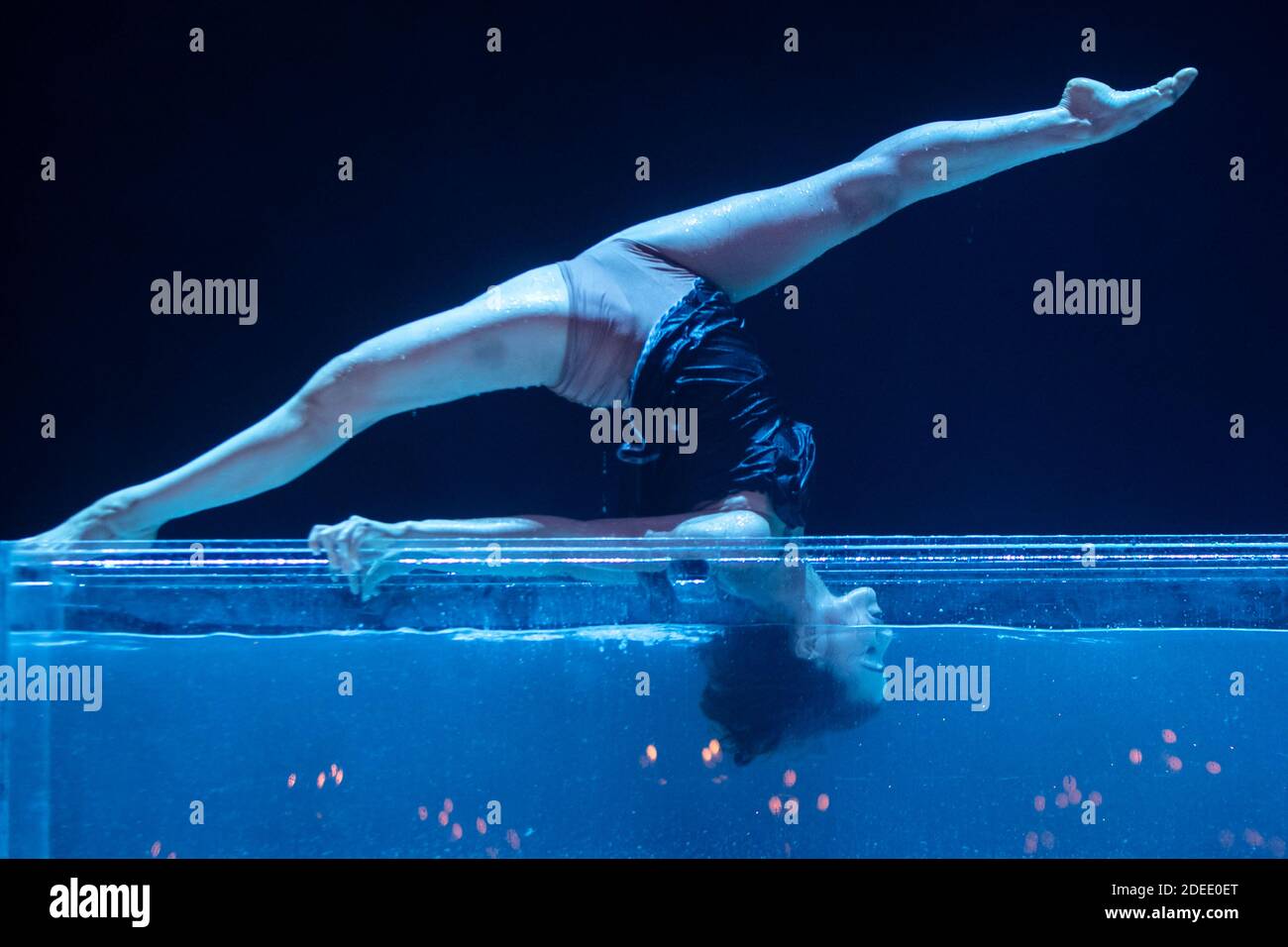 Dancer performs underwater dance routine. Stock Photo