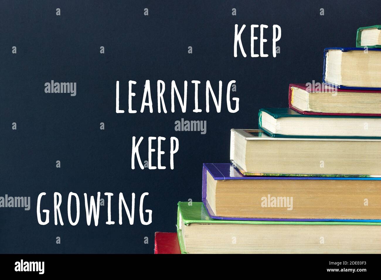 Keep learning Keep growing text and stack steps stairs of old books on
