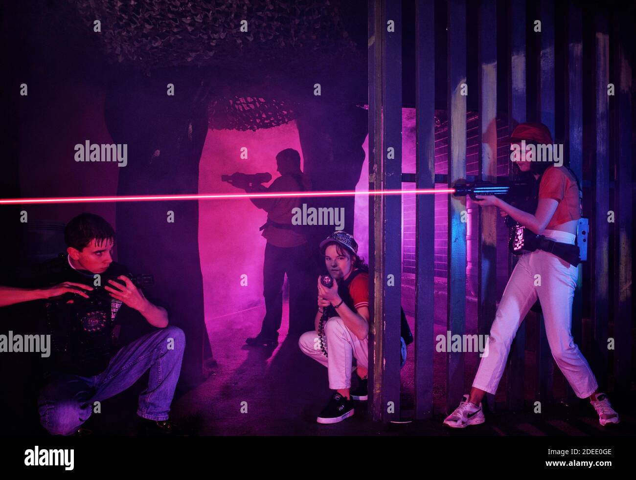 Teenage players of the game Laser Quest, Skegness pier, Lincolnshire