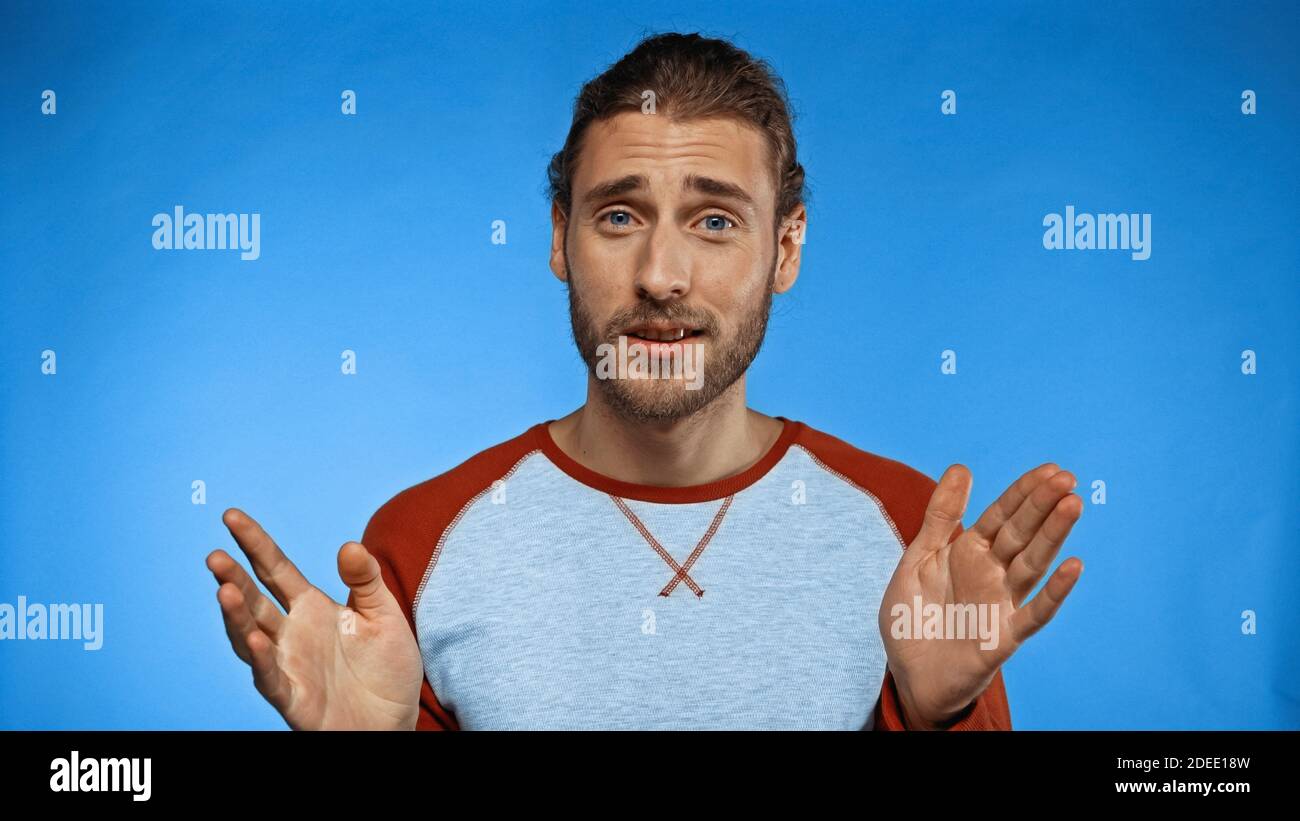 Confused bearded young man hi-res stock photography and images - Alamy