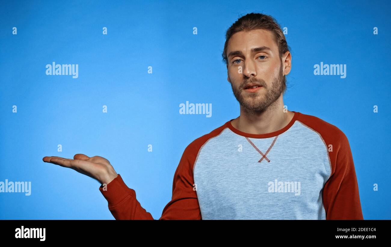 Bearded young man pointing hi-res stock photography and images - Alamy