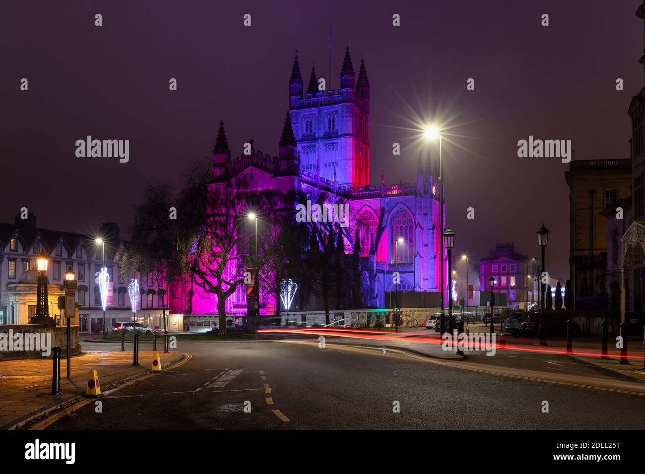 Bath Abbey lit with colourful illuminations and is part of the 2020 Christmas Light Trail in Bath City Centre, Somerset, England, UK Stock Photo