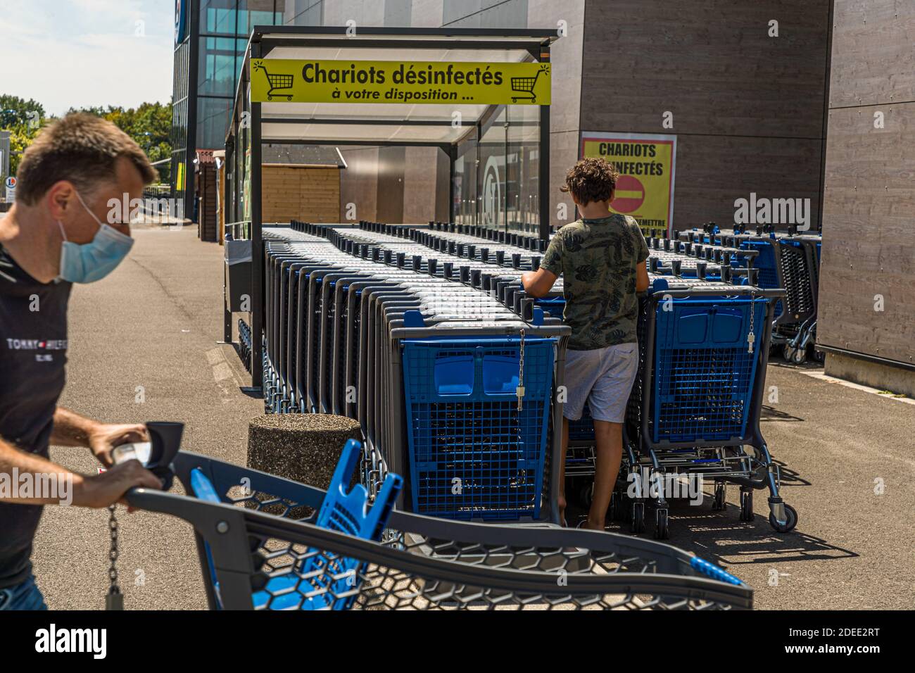 Disinfected shopping trolleys outside a French supermarket in Mulhouse