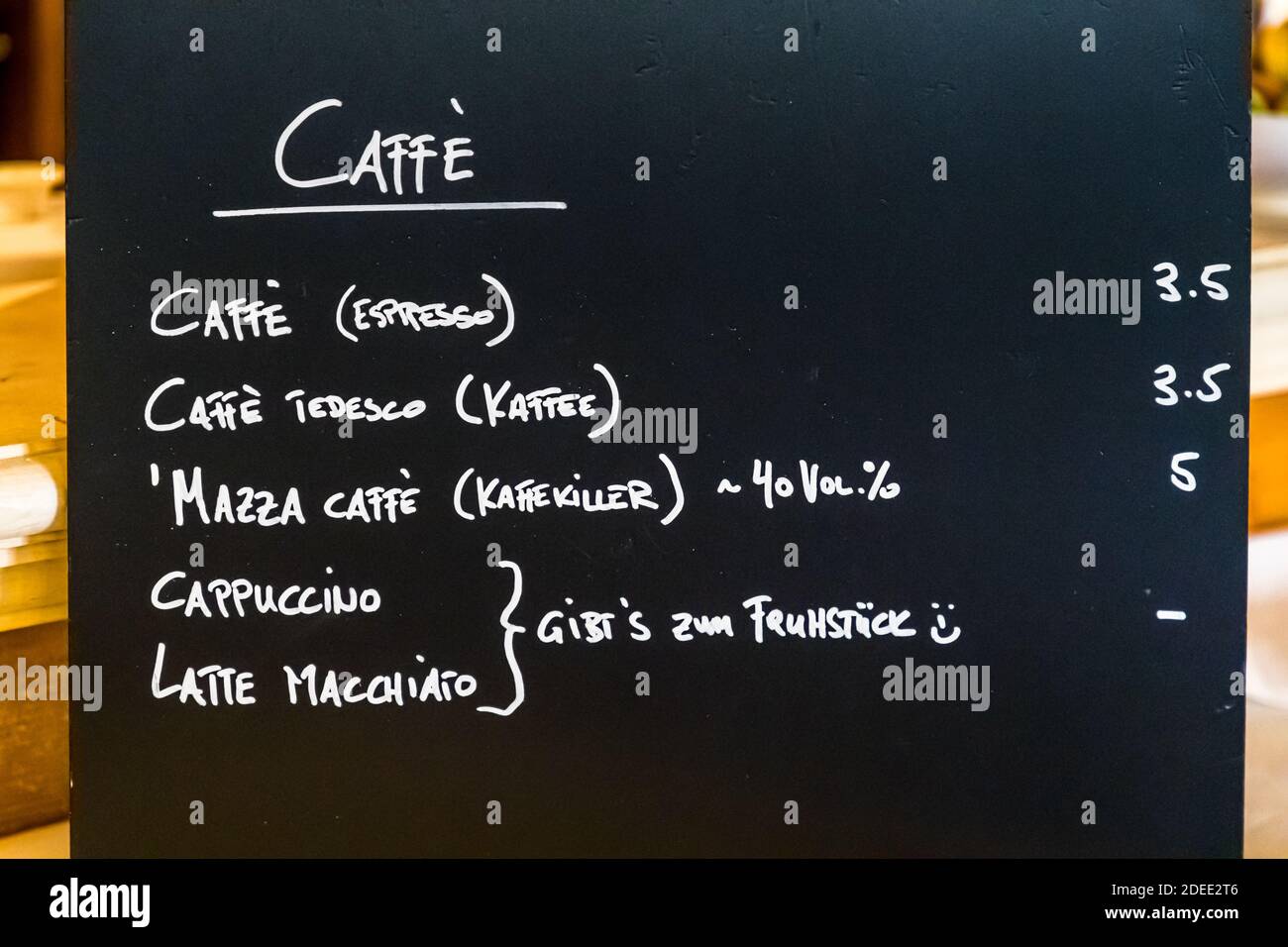 Coffee menu on the blackboard of Hotel Mühle in Binzen, Germany. At Hotel Mühle, cappuccino and latte macchiato are only available for breakfast. Anything else would be deeply un-Italian Stock Photo