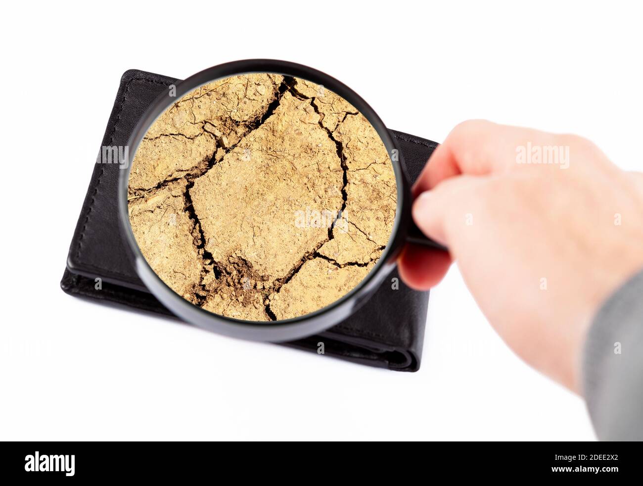 Empty wallet, no money left, drought, cracked dry earth inside. Poverty, economy financial crisis abstract concept. Personal finances dried out Stock Photo