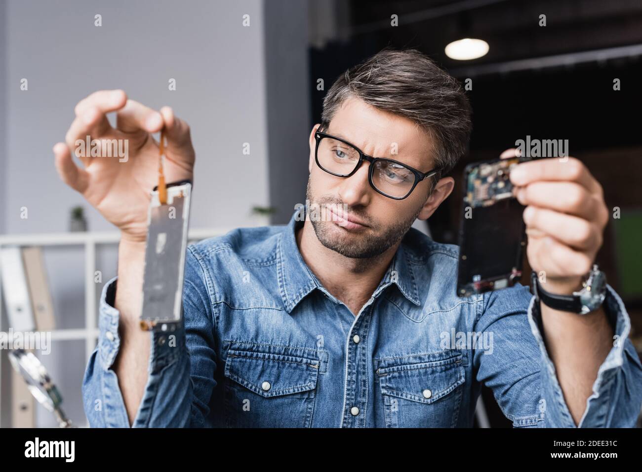 Smartphone disassembled into parts hi-res stock photography and images -  Alamy