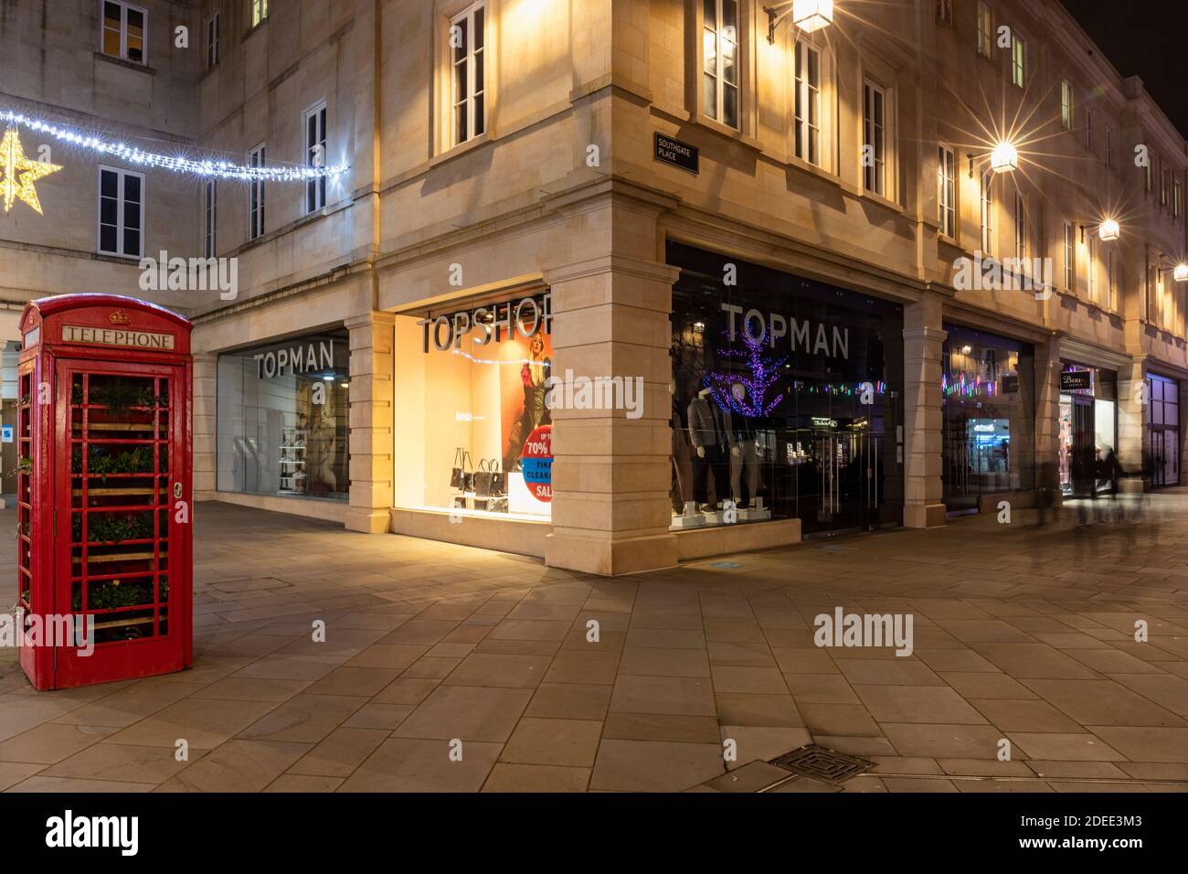 Topman & Topshop store in Southgate Shopping Centre beside a British red  Telephone Box at dusk, Bath, England , UK Stock Photo - Alamy