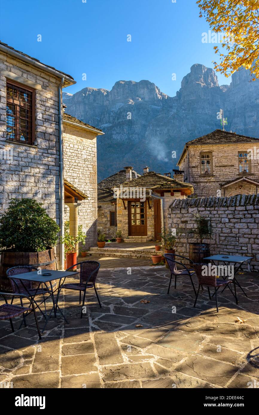 Traditional architecture  in a stone street during  fall season in the picturesque village of papigo in Epirus zagori greece Stock Photo