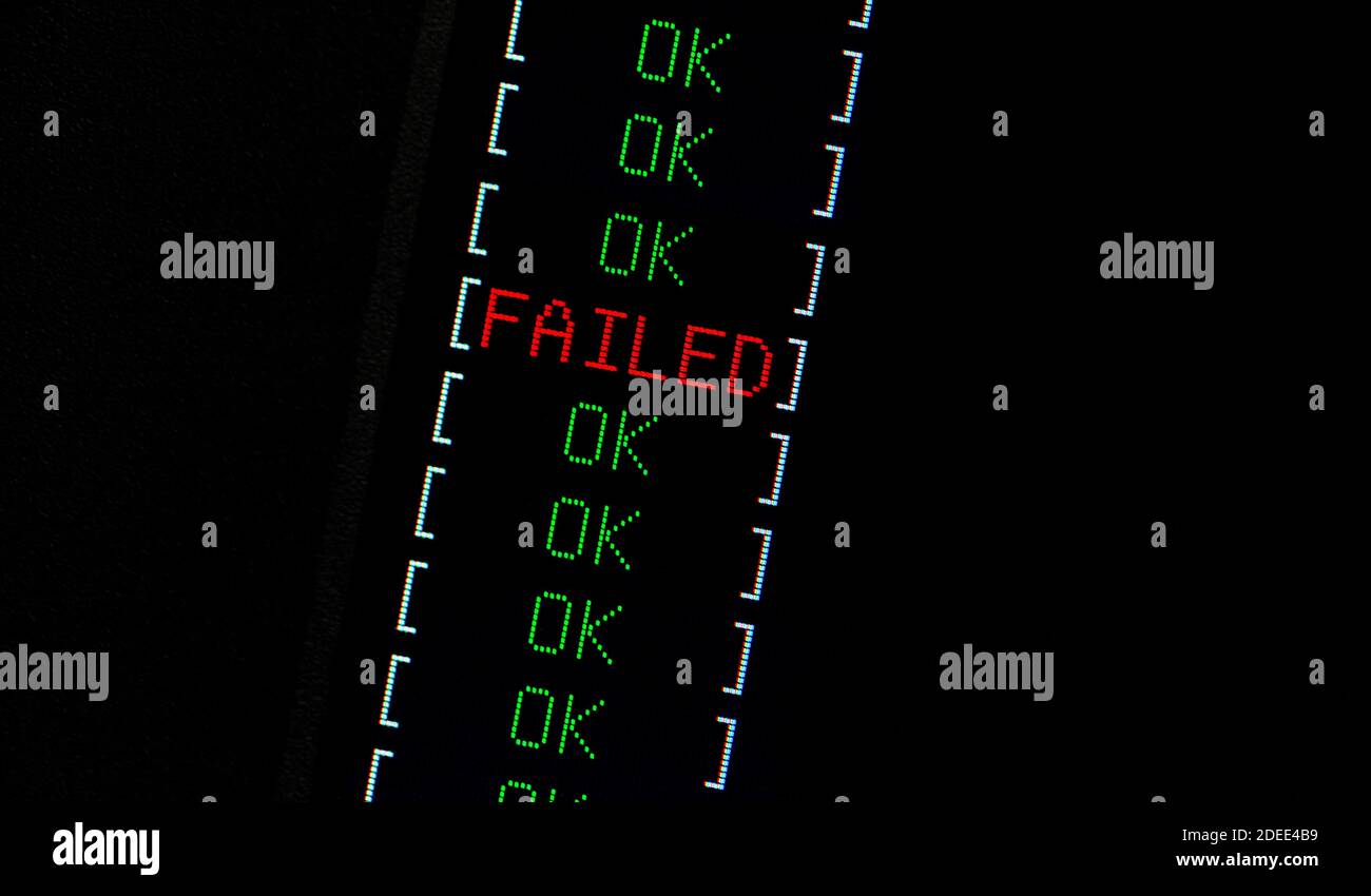 Computer failure simple abstract concept. One red FAIL indicator among many green OK passed checks. FAILED text on lcd display macro, closeup. Computa Stock Photo