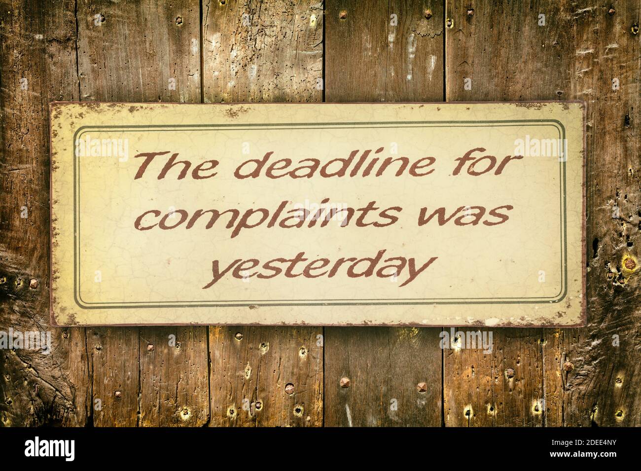 Retro styled image of an office sign with the text 'The deadline for complaints was yesterday' Stock Photo