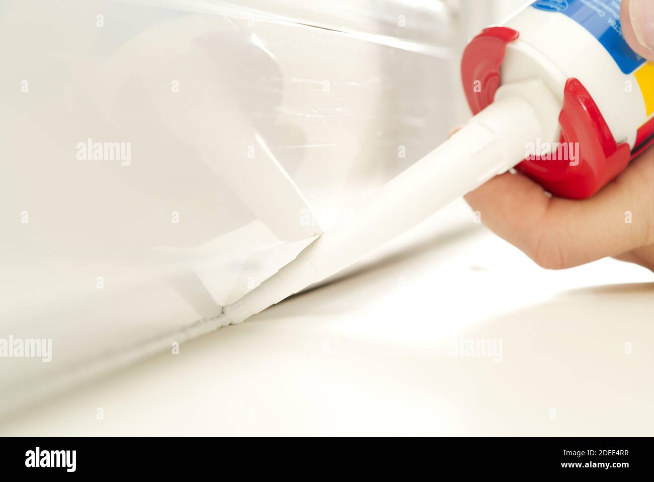 nozzle from which the silicone sealant flows, sealing the gap between Stock Photo Alamy