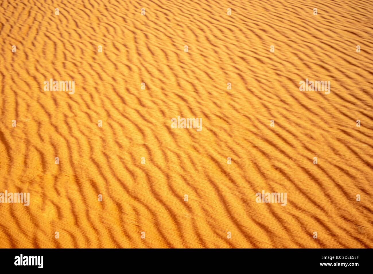 Golden sand moving background Stock Photo