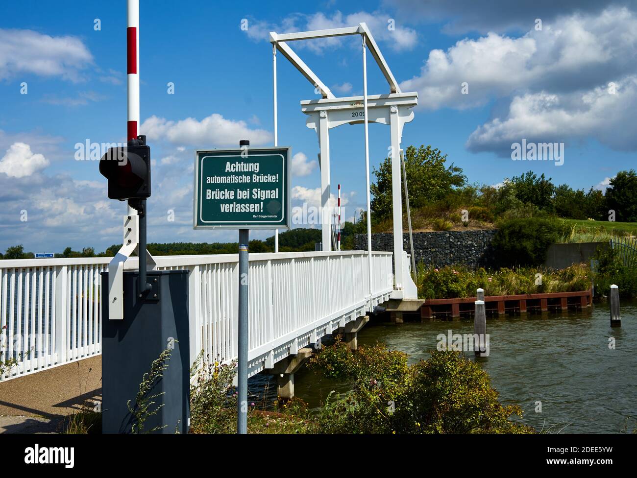Braunschweig, Germany, July 28., 2020: Drawbridge over the side arm of a canal for cyclists and pedestrians Stock Photo