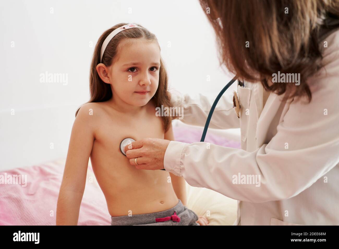 pediatric-doctor-examine-little-happy-girl-with-stethoscope-child
