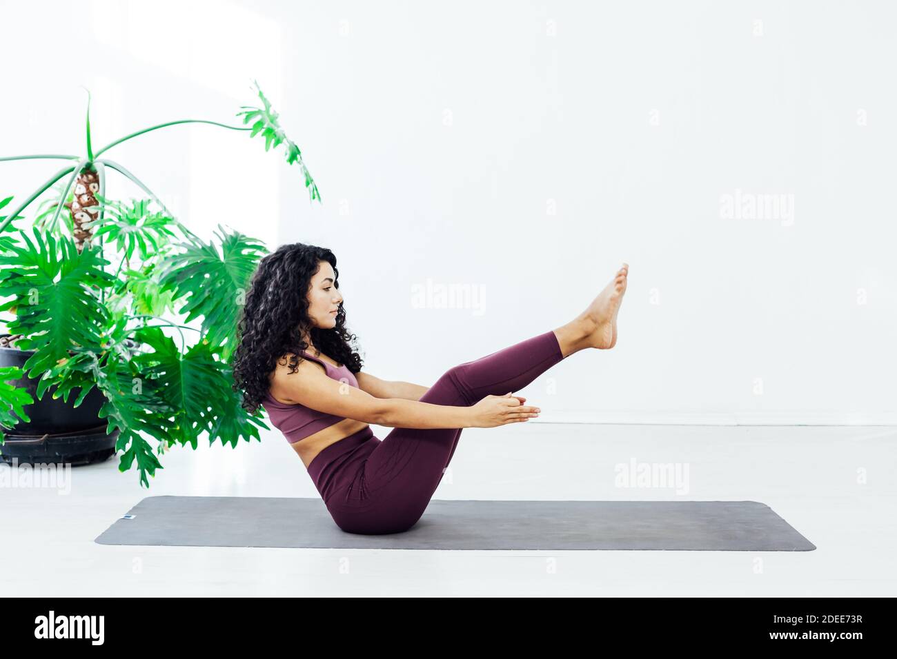 Beautiful woman yoga asana stretching the flexibility of body fitness