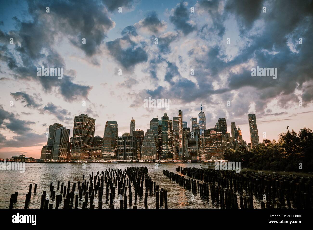 New York City skyline during dusk with storm clouds Stock Photo - Alamy