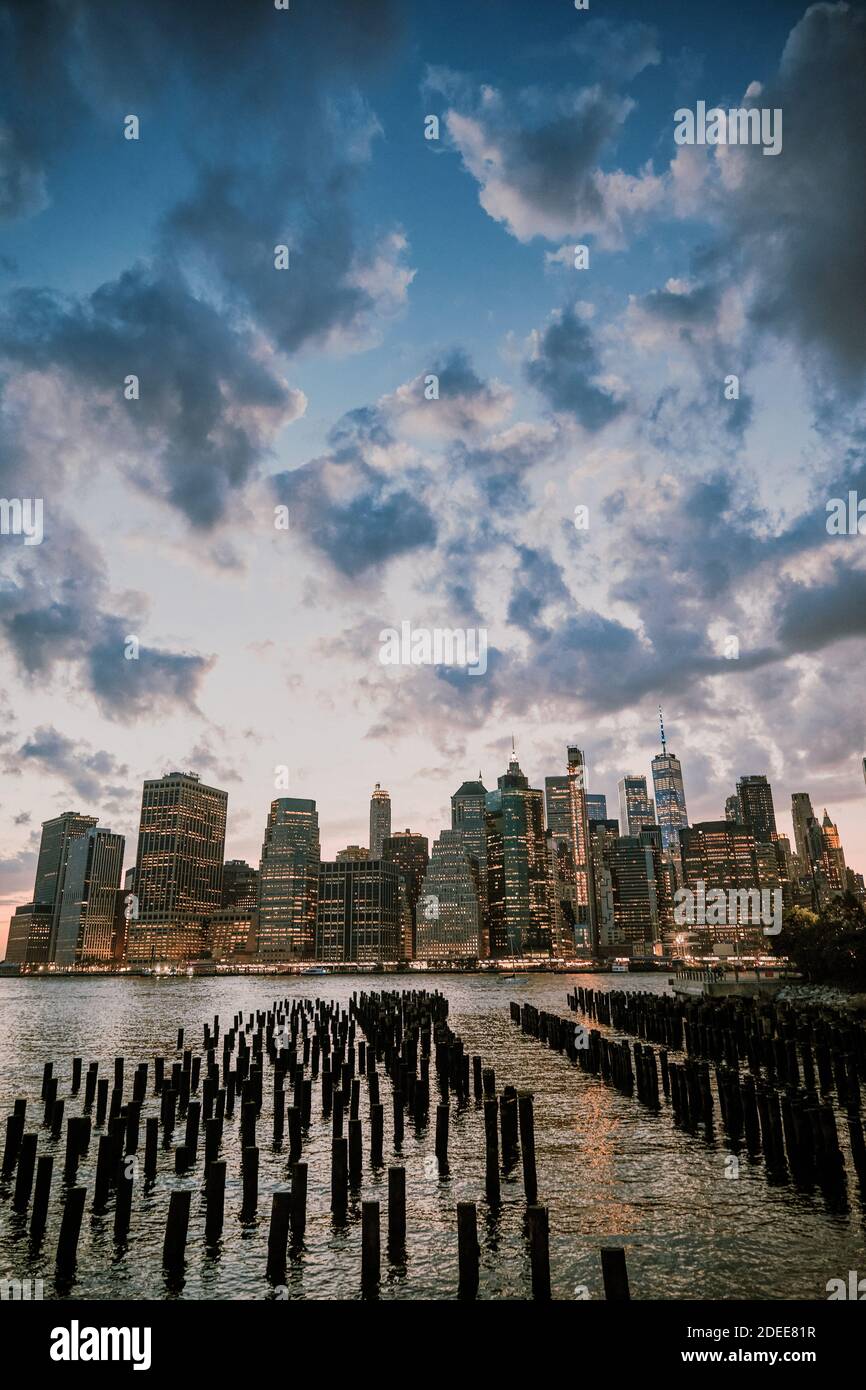 New York City skyline during dusk with storm clouds Stock Photo - Alamy