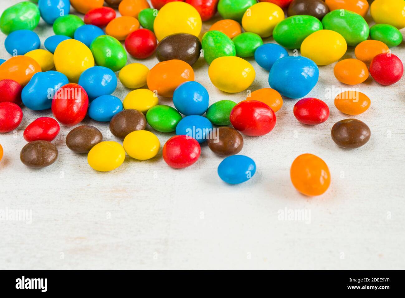 Chocolate candy on the white background, colorful candy texture, close ...