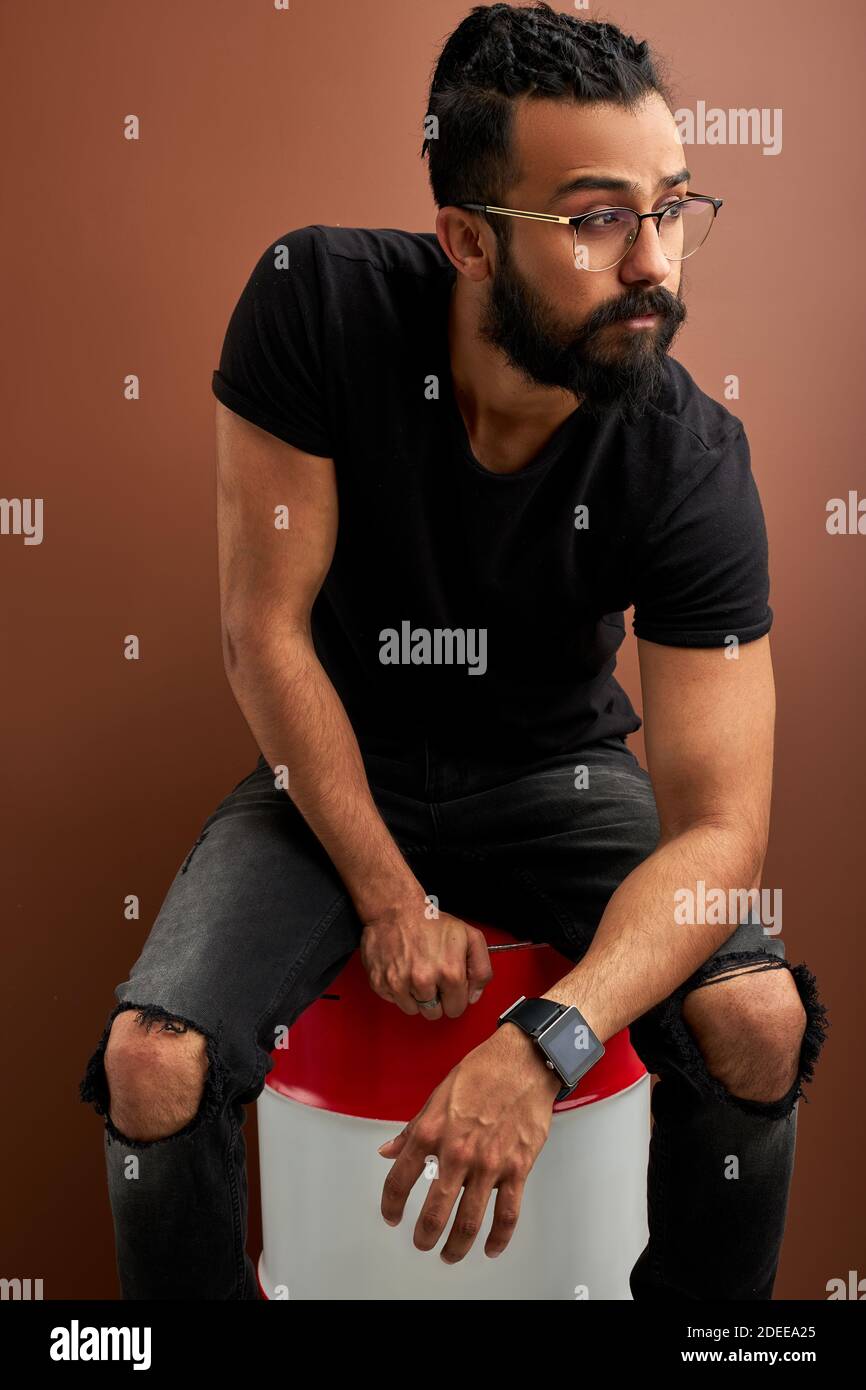 Arab Indian Guy In Casual Shirt Posing In Studio With Brown Background Handsome Fashionable Male Looking At Side Model Style Fashion People Conce Stock Photo Alamy