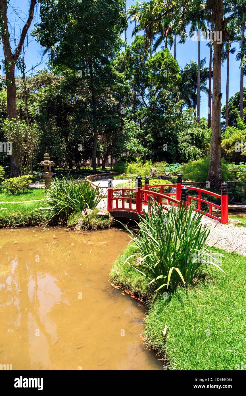RIO DE JANEIRO. Red bridge in the Japanese garden in the Botanical garden of Rio de Janeiro, Brazil. Stock Photo