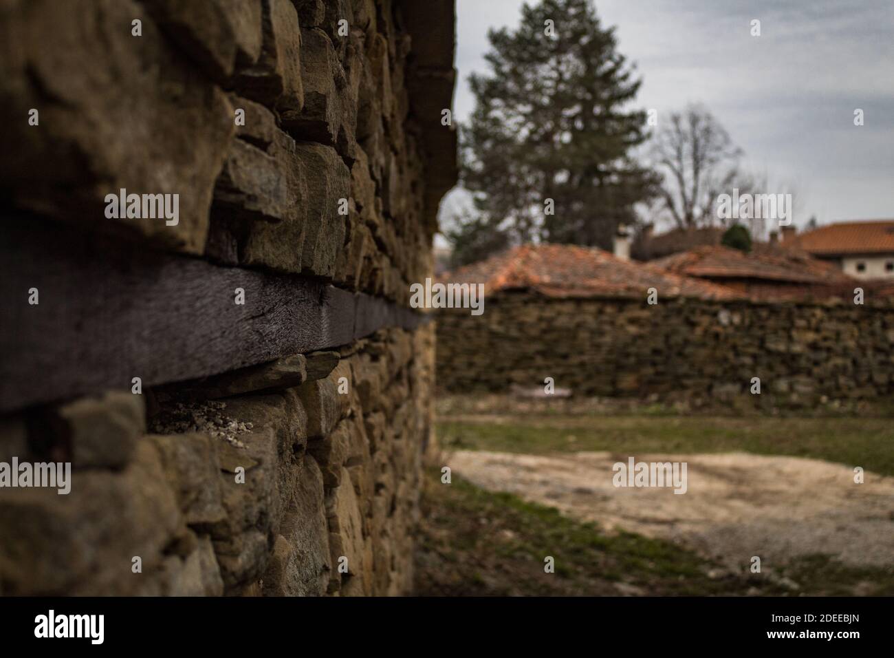 The stone wall of the church, Medven Stock Photo