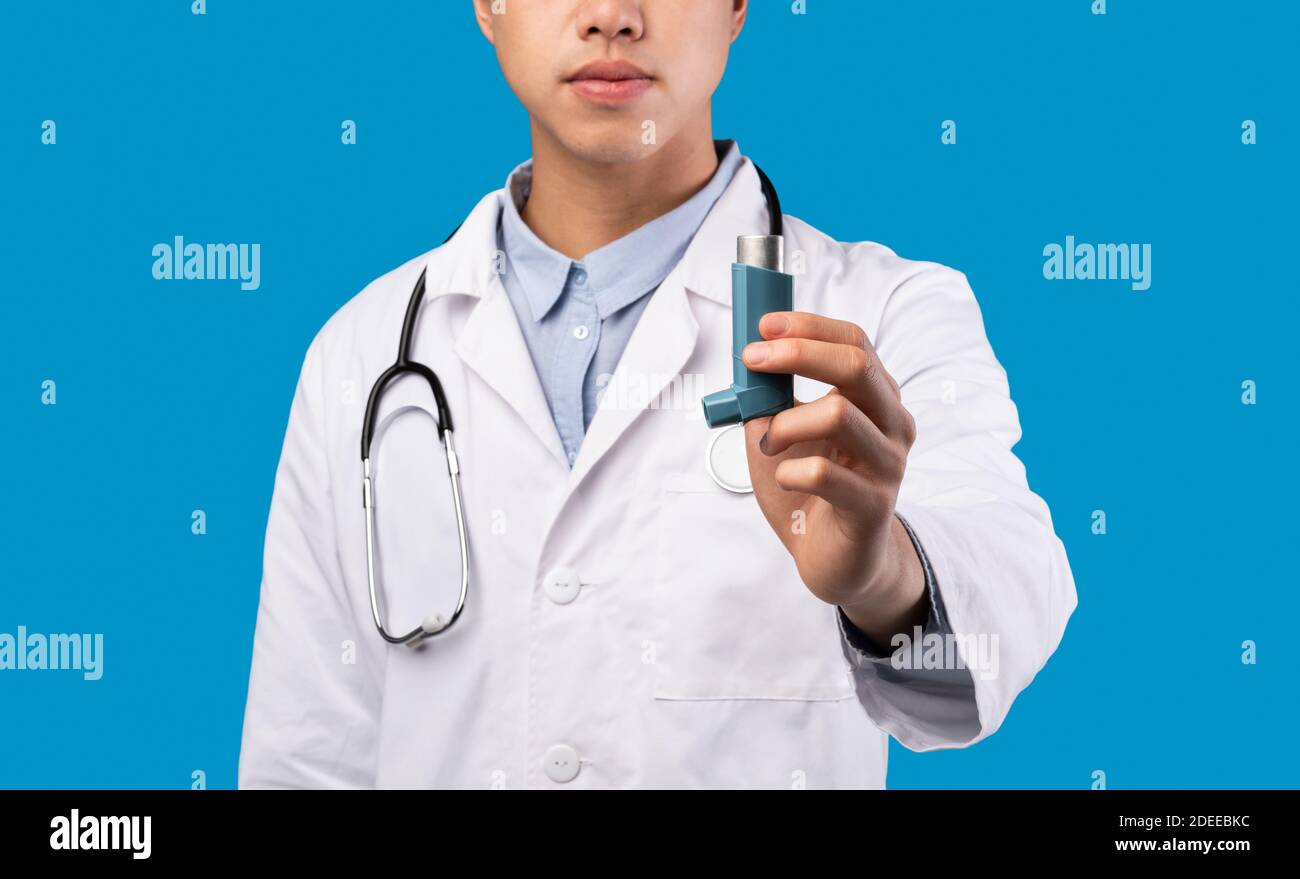 Unrecognizable doctor keeps an inhaler, treatment for asthma attacks