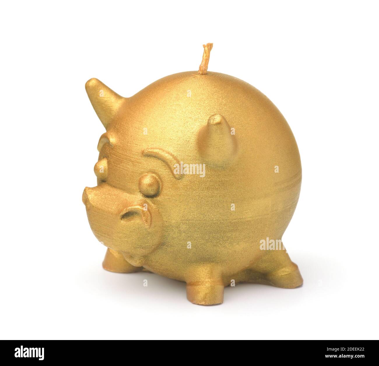 Golden bull beeswax candle isolated on white Stock Photo