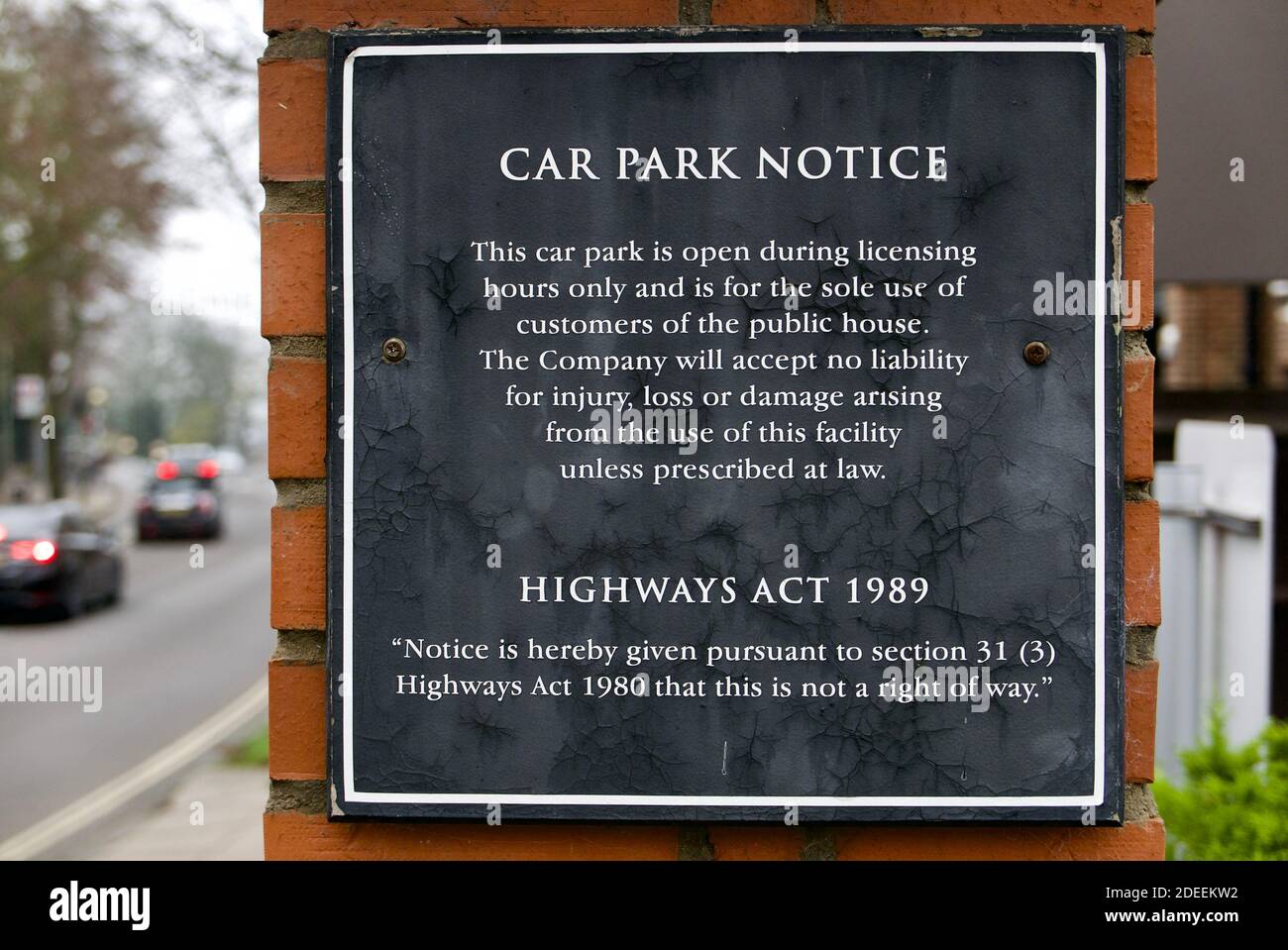 Car Park sign on a pub exterior wall excluding liability for injury, loss or damage and declaring the area not a right of way under Highways Act 1980. Stock Photo