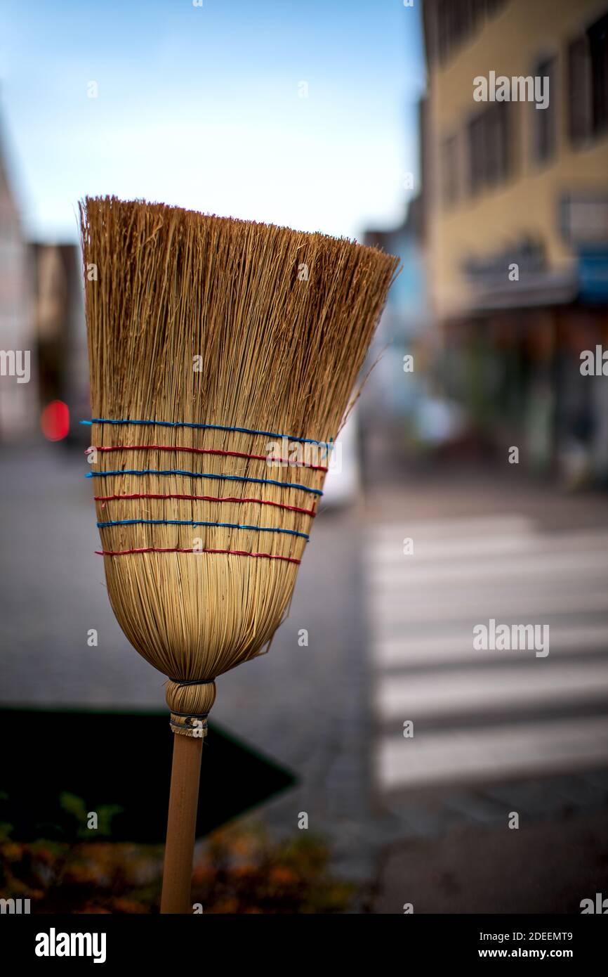 Hand made straw broom ready to sweep the street Stock Photo