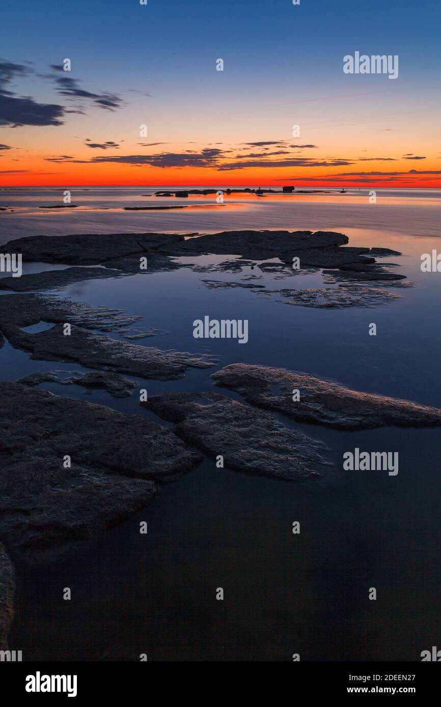 Rocks and stones in the shallow water. Baltic sea shoreline. Late ...