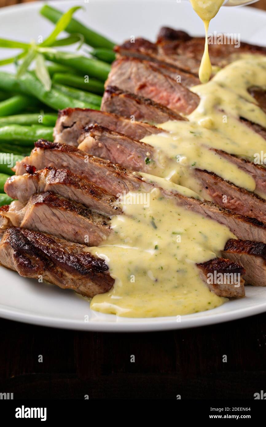Steak with bearnaise sauce with tarragon Stock Photo Alamy
