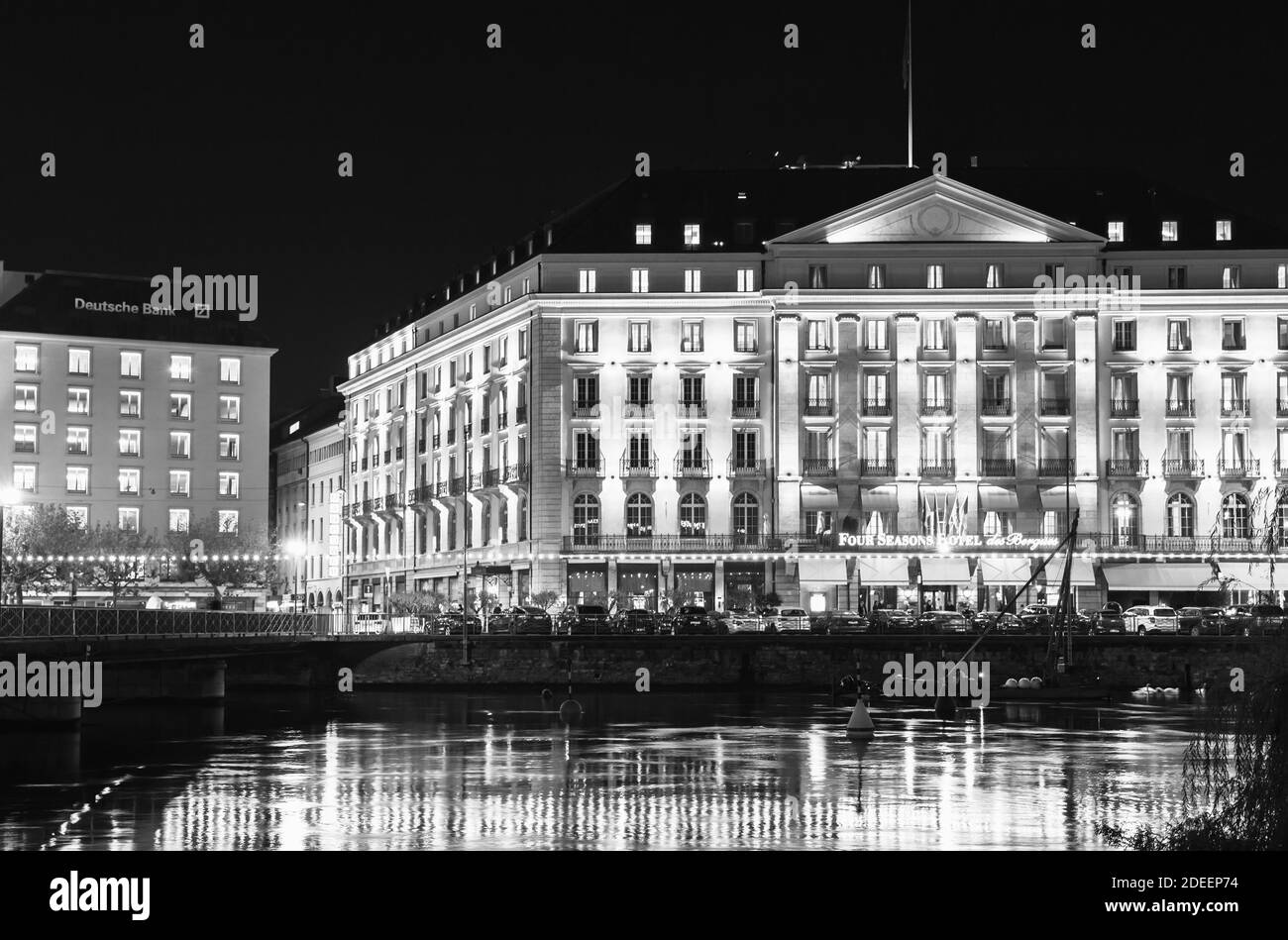 Geneva, Switzerland - November 24, 2016: Night cityscape with illuminated facade of Four Seasons Hotel, black and white photo Stock Photo