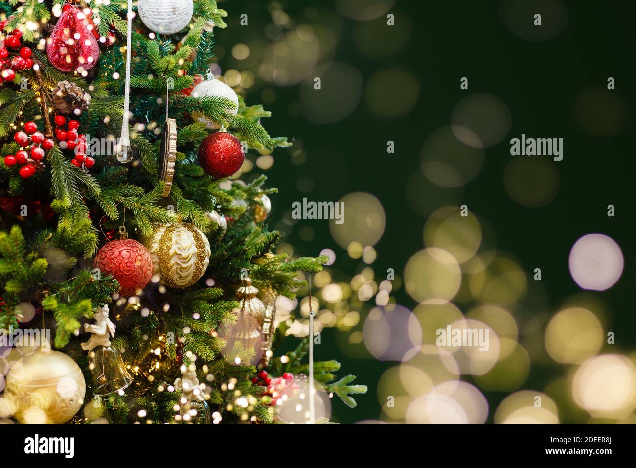 Christmas tree with decorations and lights background Stock Photo - Alamy