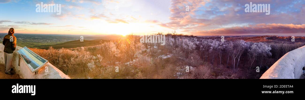 Gaaden: view from observation tower Wilhelmswarte at mountain Anninger to South with Wienerwald and Alps, rime ice on tree tops, sunset in Wienerwald, Stock Photo