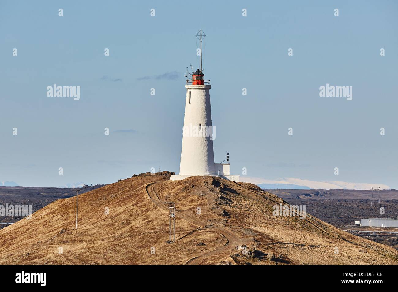 Old White Lighthouse on a hill Stock Photo