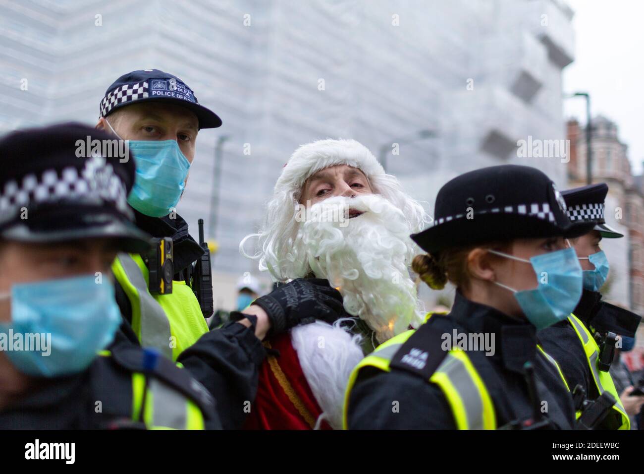 Antilockdown protest, London, 28 November 2020. A protester dressed as Father Christmas is