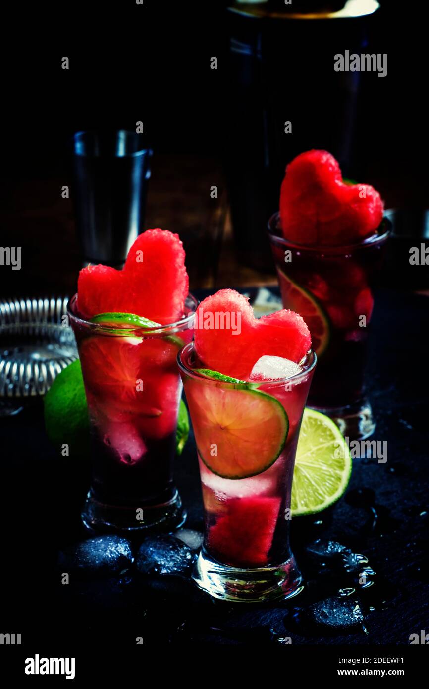 Alcoholic cocktail pasteque with vodka, watermelon juice, lime and ice. Bar tools on dark background, selective focus Stock Photo