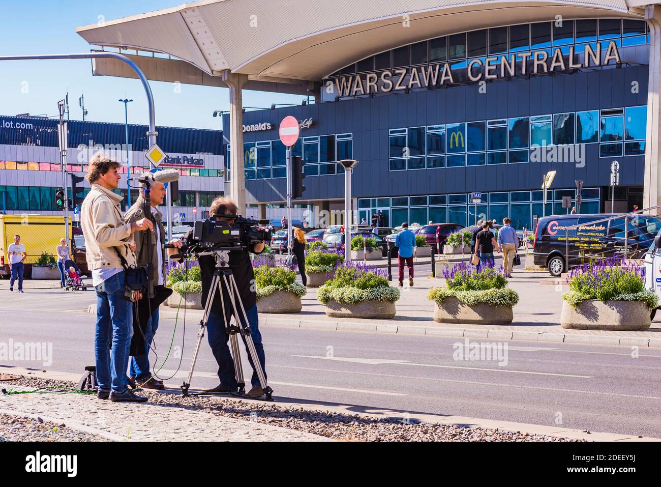 Television crew filming in the center of Warsaw, Poland, Europe Stock Photo
