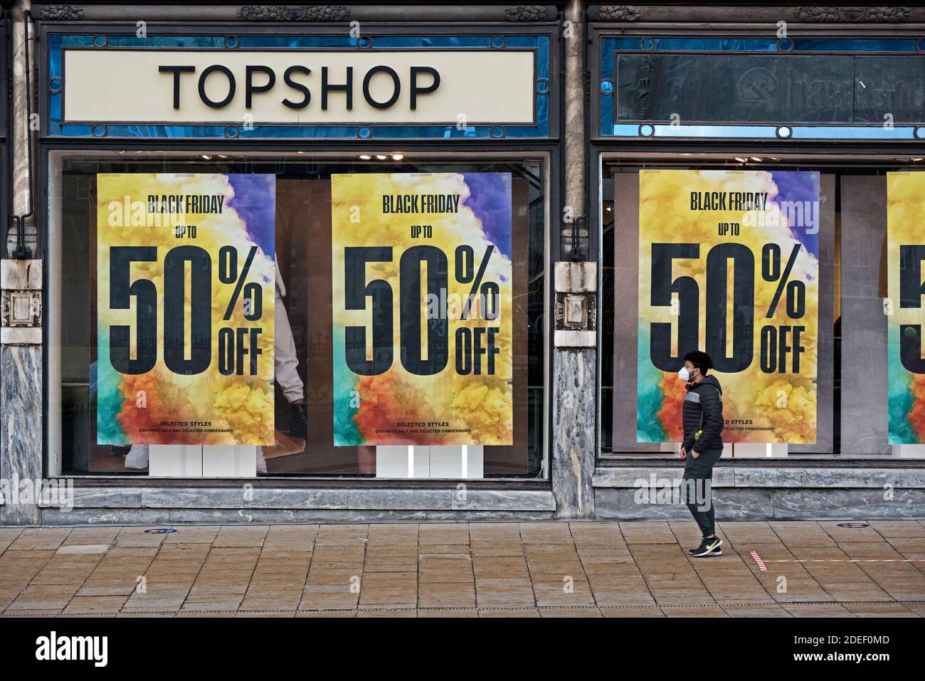 Black Friday adverts in the window of Topshop,part of Sir Philip Green's retail empire Arcadia, now in administration. Princes Street, Edinburgh. Stock Photo
