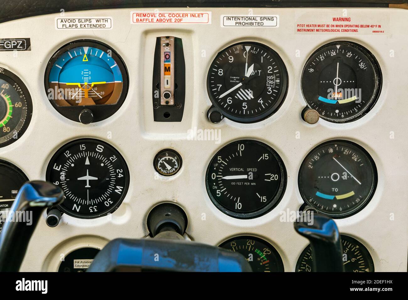 Closeup of an analog instrument panel in a vintage Cessna 172. Stock Photo