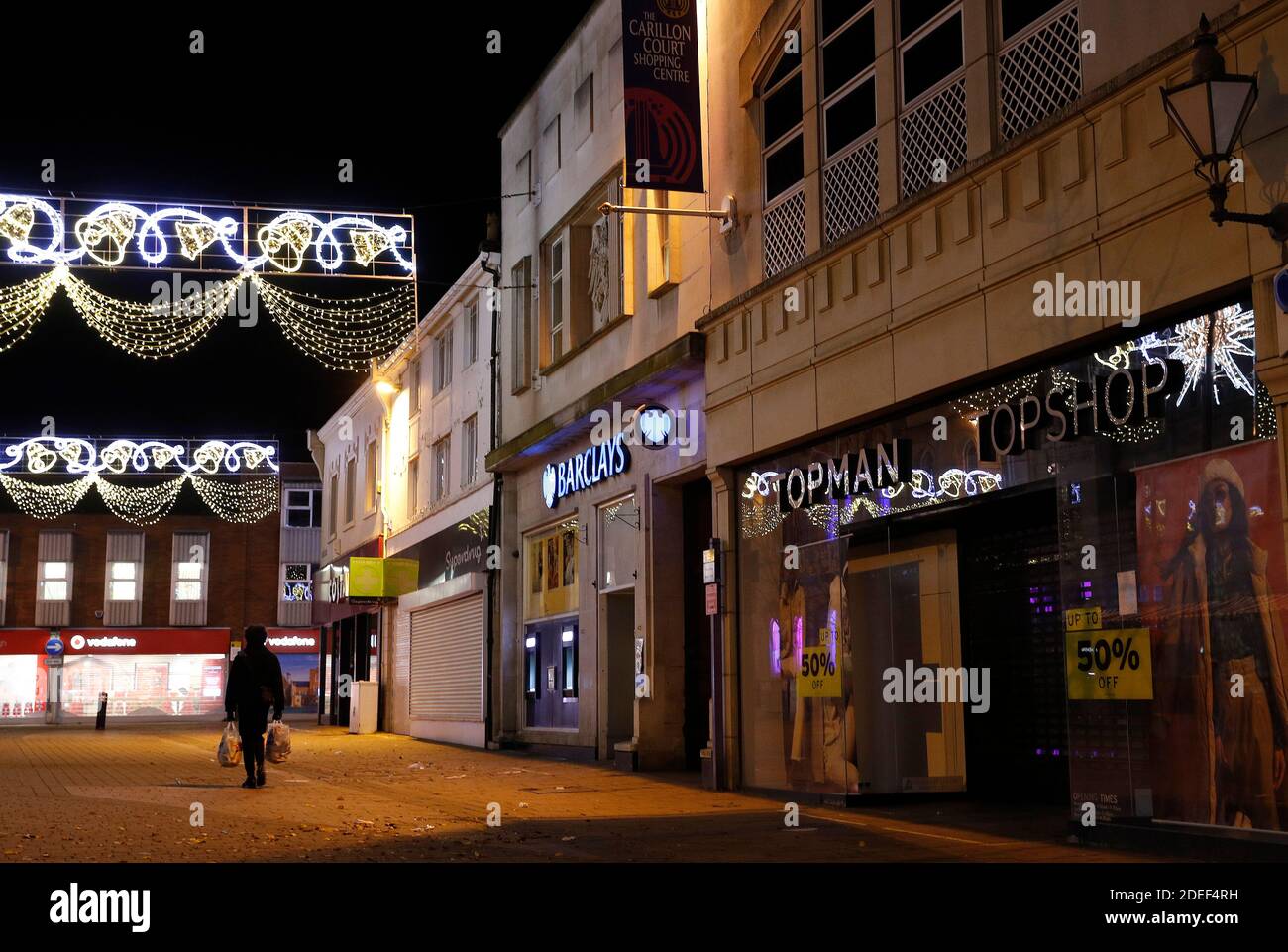 Loughborough, Leicestershire, UK. 30th November 2020. A man walks past a  Topman and Topshop store after the Arcadia Group entered into  administration putting 13,000 jobs at risk. Credit Darren Staples/Alamy  Live News
