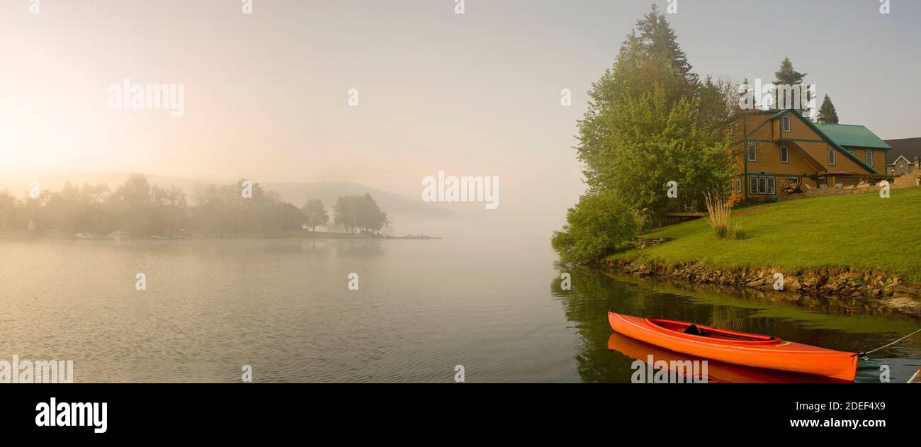 Lake House with Canoe Stock Photo Alamy