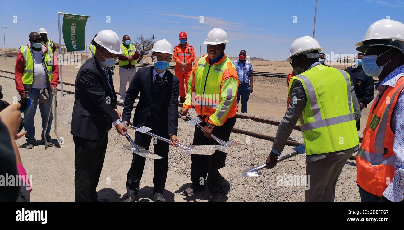 (201130) -- ARANDIS (NAMIBIA), Nov. 30, 2020 (Xinhua) -- Officials from Namibian Ministry of Works and Transport and China Gezhouba Group Corporation in Namibia break ground for the project of the rehabilitation and upgrading of the railway line between Walvis Bay and Arandis in Arandis, western Namibia, on Nov. 30, 2020. The Namibian government's plan to develop the country into a transport and logistics hub in southern Africa helped by the groundbreaking of the rehabilitation and upgrading of the railway line between Walvis Bay and Arandis on Monday. The project will be undertaken by China G Stock Photo