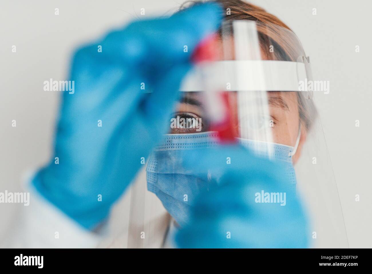 Female doctor wearing protective equipment working - closeup up eye - coronavirus health concept Stock Photo