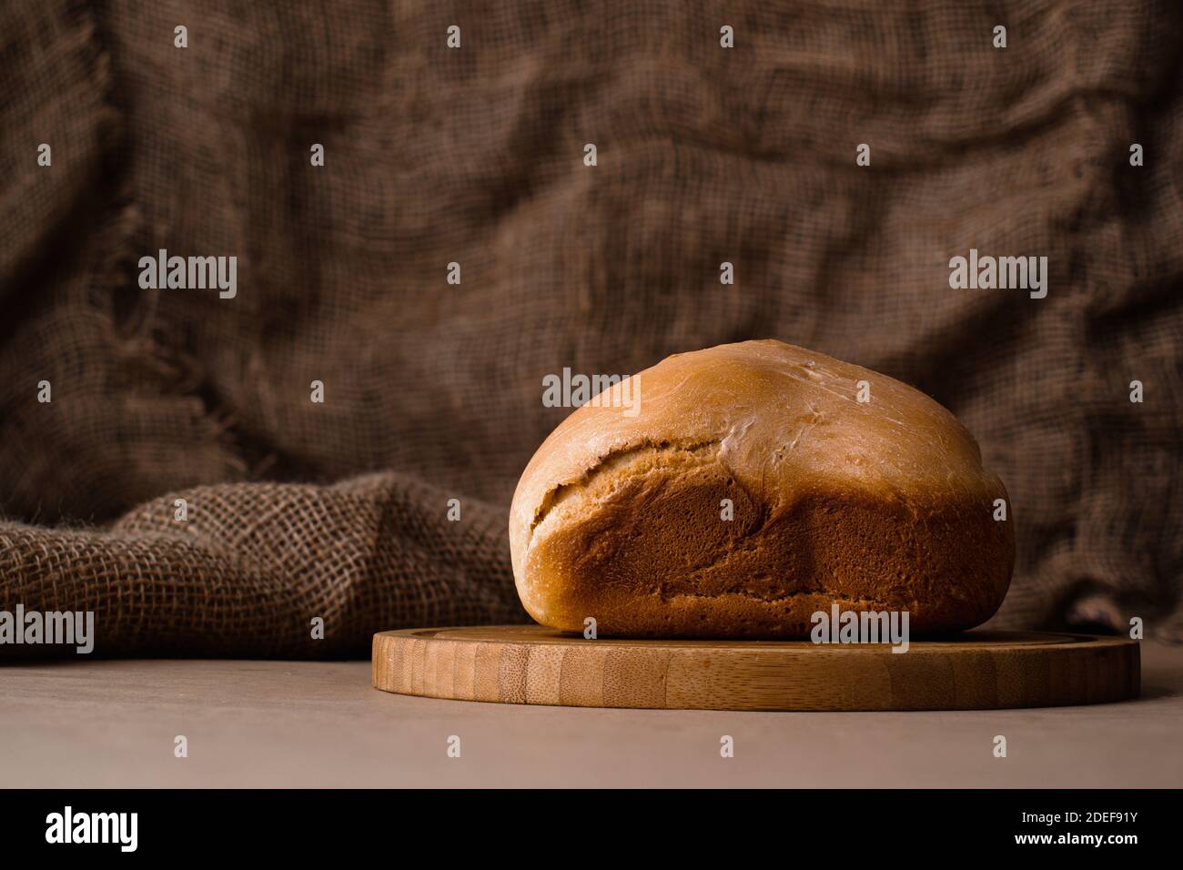 Homemade loaf of bread on cutting board Stock Photo - Alamy