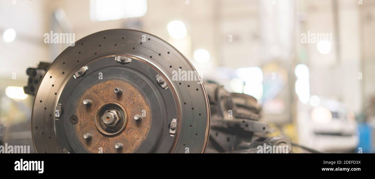 close up metal chrome brake disk, repair vehicle parts of the sport car