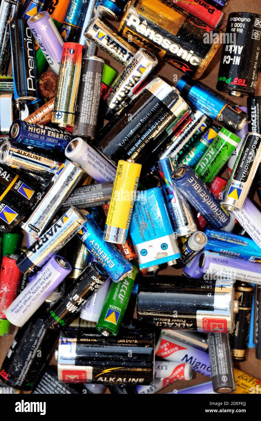Collection of old and empty batteries of different brands Stock Photo