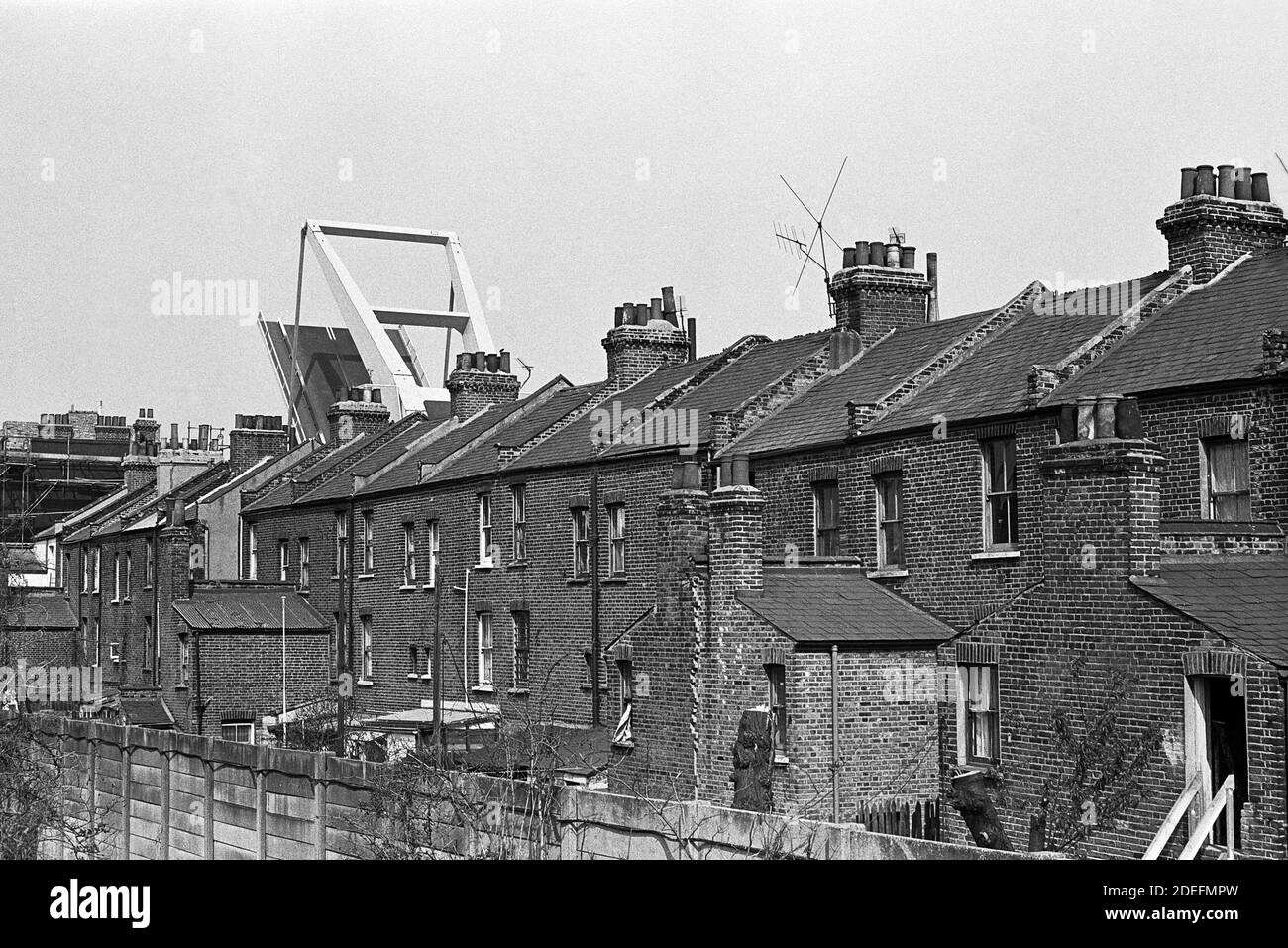 UK, London, Docklands, Isle of Dogs. early 1974. Glen Terrace & the raised Blue Bridge, back of the terrace on Manchester Road. West India south dock. Stock Photo