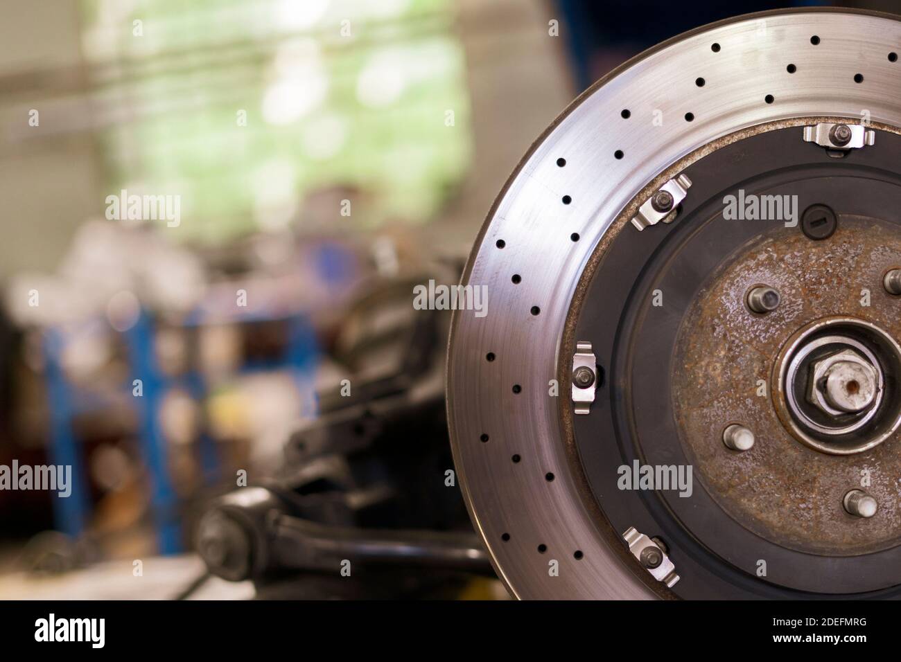 close up metal chrome brake disk, repair vehicle parts of the sport car
