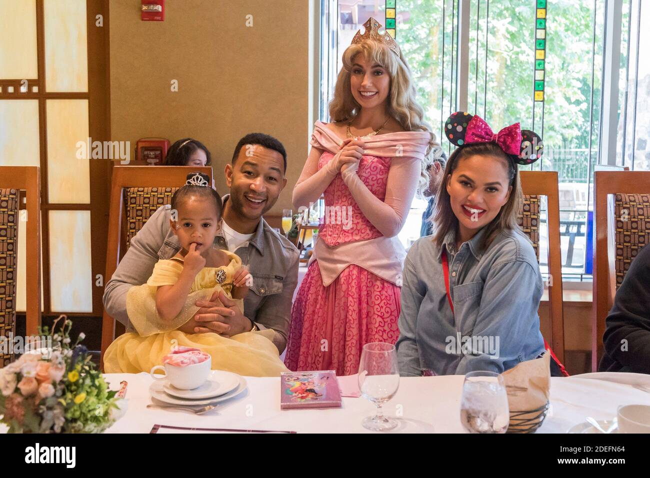Hand Out Photo - John Legend, Chrissy Teigen and their daughter Luna pose with Princess Aurora during the new Disney Princess Breakfast Adventures at Disney’s Grand Californian Hotel in Anaheim, CA, USA on April 12, 2019. Photo by Joshua Sudock/Disneyland via ABACAPRESS.COM Stock Photo